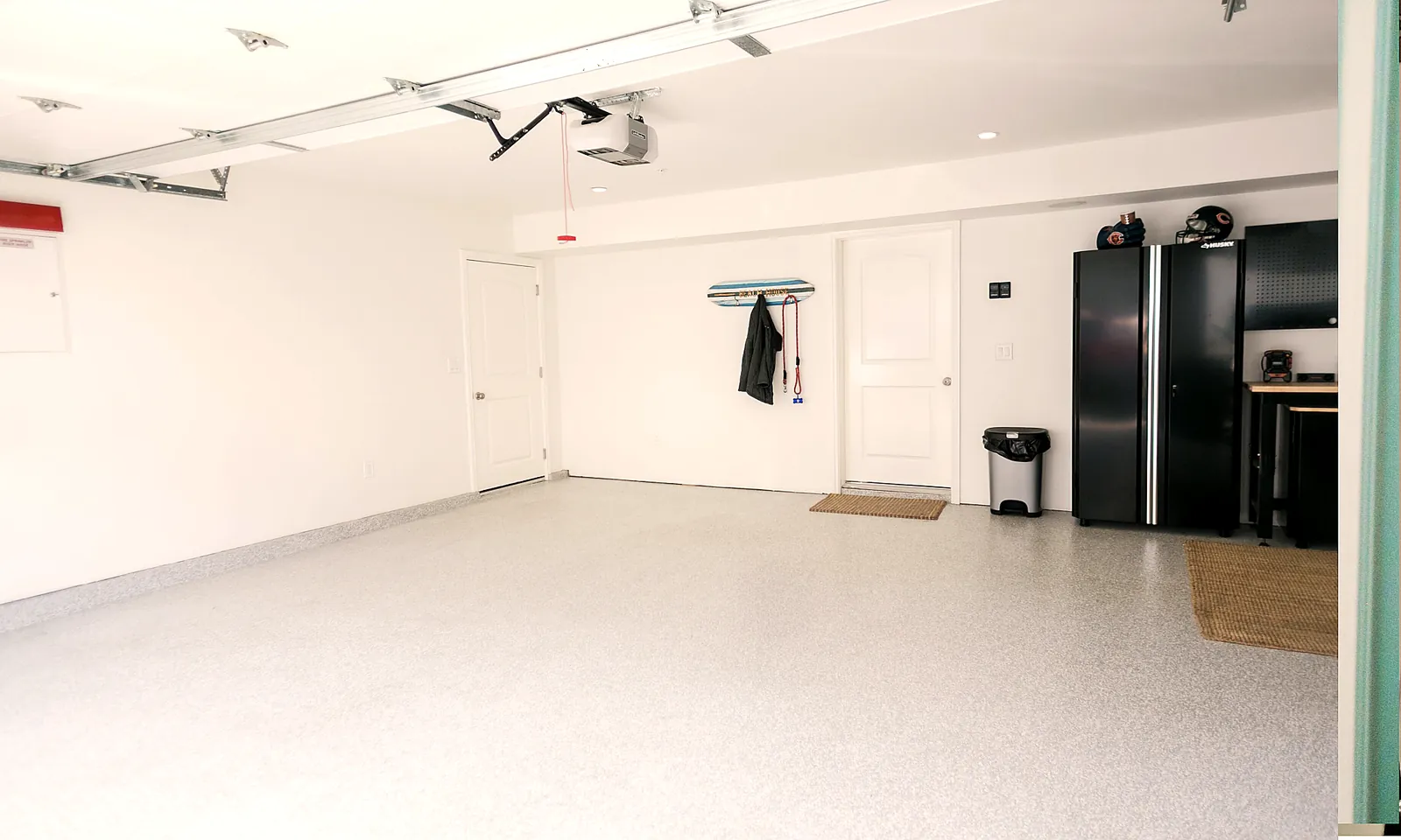 Three-car garage with two open spots