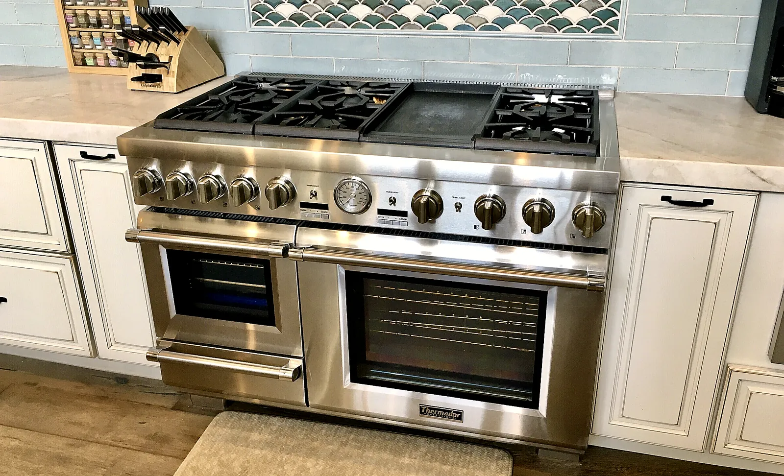 Professional range and tile backsplash