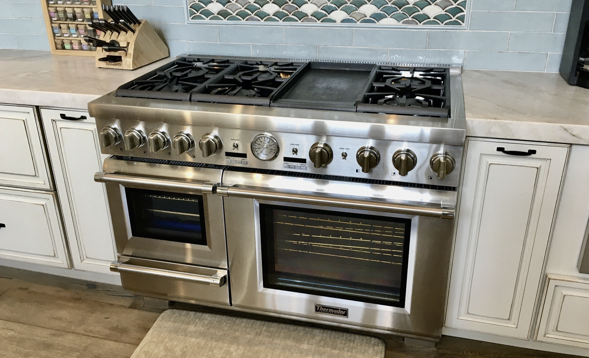 Professional range and tile backsplash